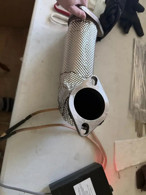 WRX downpipe skinned in 0.1mm 304 stainless foil, with the spot welder used to seam it